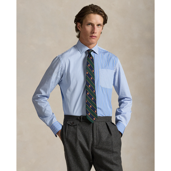 Decades ago, tailors would learn their craft by sewing together shirts made from fabric remnants. Over time, a staple of playful preppy style evolved from this practice – the fun shirt. This version combines four striped palettes into a single statement-making oxford adorned with custom-developed genuine mother-of-pearl buttons. Its bespoke cotton cloth is tailored by Thomas Mason – a storied European mill renowned for its exquisite fabrics.