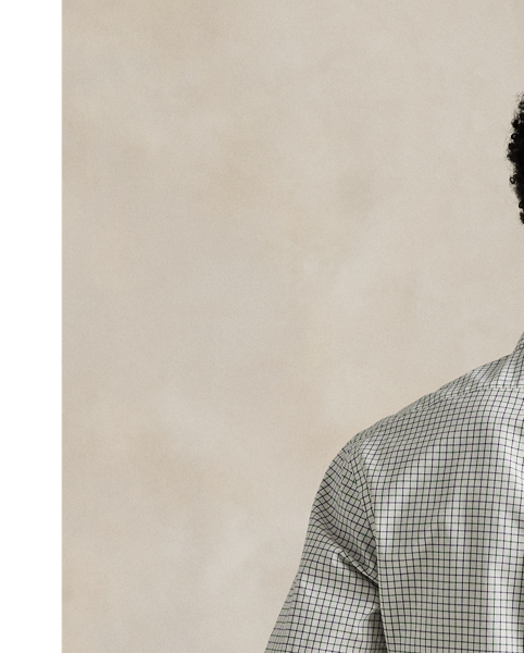 Meticulously crafted from lightweight cotton poplin, this tattersall shirt delivers impeccable Polo style with its silky texture and precise tailoring. The classic design is further elevated by our iconic embroidered Pony on the right hem, which adds a distinctive signature touch.