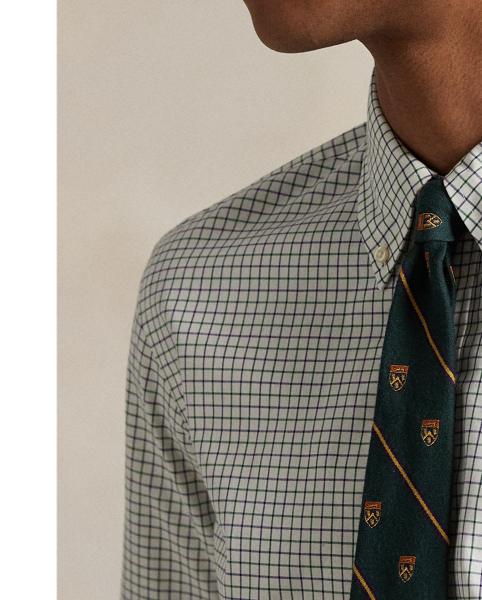 Meticulously crafted from lightweight cotton poplin, this tattersall shirt delivers impeccable Polo style with its silky texture and precise tailoring. The classic design is further elevated by our iconic embroidered Pony on the right hem, which adds a distinctive signature touch.