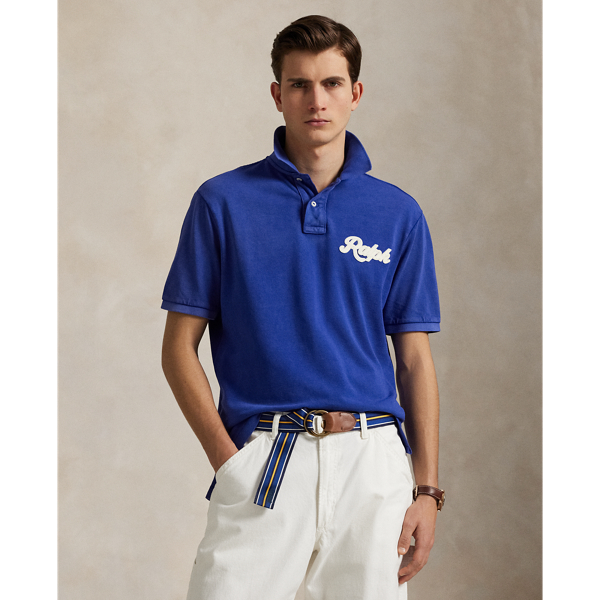 An American style standard since 1972, the Polo shirt has been imitated but never matched. Over the decades,  Ralph Lauren Lauren has reimagined his signature style in a wide array of colours and fits, yet all retain the quality and attention to detail of the iconic original. This cotton mesh version features our founder's first name rendered in a felt patch with chain-stitched embroidery.