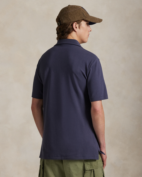 An American style standard since 1972, the Polo shirt has been imitated but never matched. Over the decades, Ralph Lauren Lauren has re-imagined his signature style in a wide array of colours and fits, yet all retain the quality and attention to detail of the iconic original. This version is made with our highly breathable cotton mesh and embroidered with our beloved Polo Bear.