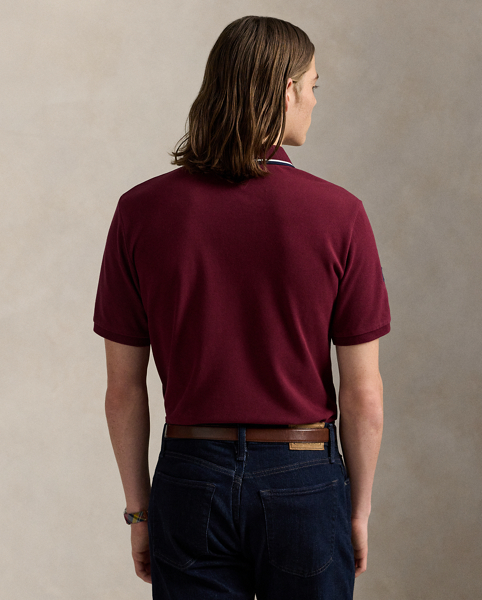 An American style standard since 1972, the Polo shirt has been imitated but never matched. Over the decades, Ralph Lauren Lauren has reimagined his signature style in a wide array of colours and fits, yet all retain the quality and attention to detail of the iconic original. This mesh version features an equestrian-inspired crest celebrating 20 years of Ralph Lauren Lauren's iconic Big Pony.