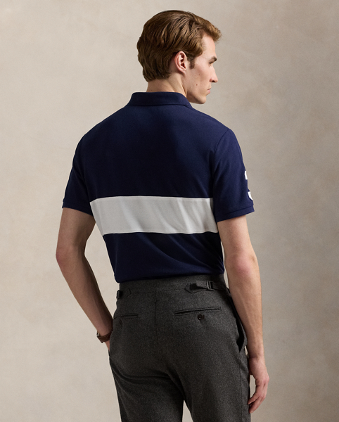 An American style standard since 1972, the Polo shirt has been imitated but never matched. Over the decades, Ralph Lauren Lauren has reimagined his signature style in a wide array of colours and fits, yet all retain the quality and attention to detail of the iconic original. This mesh version features an equestrian-inspired crest that celebrates 20 years of Ralph Lauren Lauren's iconic Big Pony.