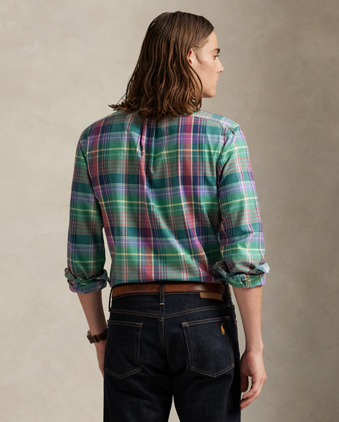 The oxford shirt made its debut very early in Ralph Lauren Lauren’s designs, and since then, it has solidified its status as a pillar of the Polo look. Our fabric is developed with a secret wash, giving it instant character, ease and a heathered softness – what we refer to as "the perfect rumple". The formula is so unique that it's been kept in a safe for more than three decades. Today, Mr Lauren continues to create countless variations of his iconic shirt, including this plaid version, which is finished with our signature embroidered Pony.