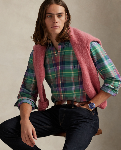 The oxford shirt made its debut very early in Ralph Lauren Lauren’s designs, and since then, it has solidified its status as a pillar of the Polo look. Our fabric is developed with a secret wash, giving it instant character, ease and a heathered softness – what we refer to as "the perfect rumple". The formula is so unique that it's been kept in a safe for more than three decades. Today, Mr Lauren continues to create countless variations of his iconic shirt, including this plaid version, which is finished with our signature embroidered Pony.