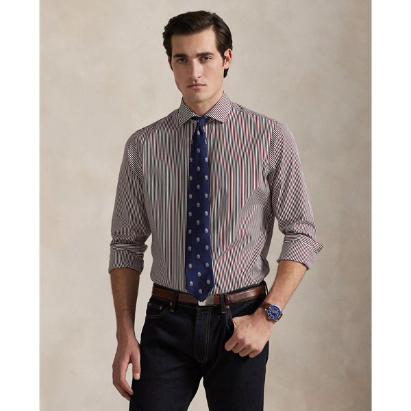 Meticulously crafted with lightweight cotton poplin, this striped shirt delivers impeccable Polo style with its crisp texture and precise tailoring. The classic design is further elevated by our iconic embroidered Pony, which adds a distinctive signature touch.