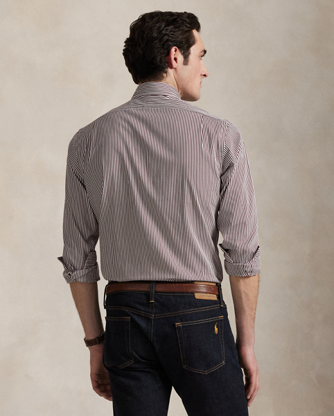 Meticulously crafted with lightweight cotton poplin, this striped shirt delivers impeccable Polo style with its crisp texture and precise tailoring. The classic design is further elevated by our iconic embroidered Pony, which adds a distinctive signature touch.