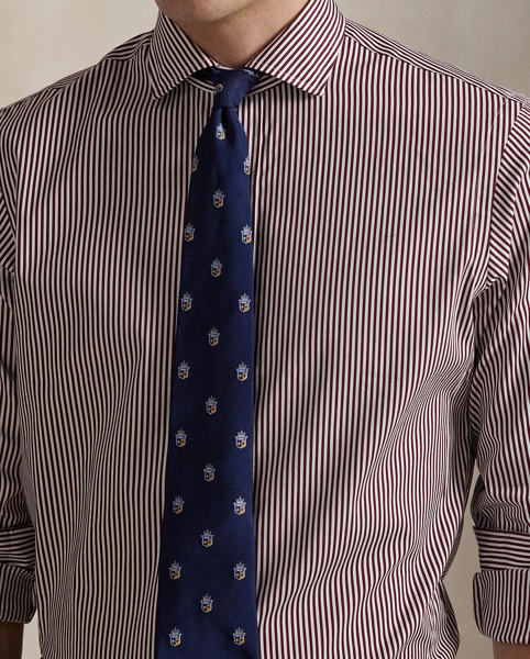 Meticulously crafted with lightweight cotton poplin, this striped shirt delivers impeccable Polo style with its crisp texture and precise tailoring. The classic design is further elevated by our iconic embroidered Pony, which adds a distinctive signature touch.