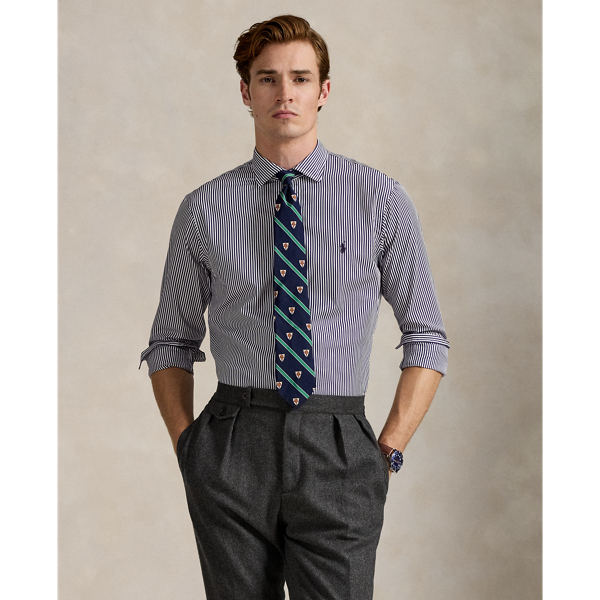 Meticulously crafted with lightweight cotton poplin, this striped shirt delivers impeccable Polo style with its crisp texture and precise tailoring. The classic design is further elevated by our iconic embroidered Pony, which adds a distinctive signature touch.