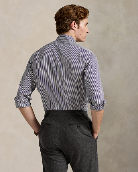 Meticulously crafted with lightweight cotton poplin, this striped shirt delivers impeccable Polo style with its crisp texture and precise tailoring. The classic design is further elevated by our iconic embroidered Pony, which adds a distinctive signature touch.