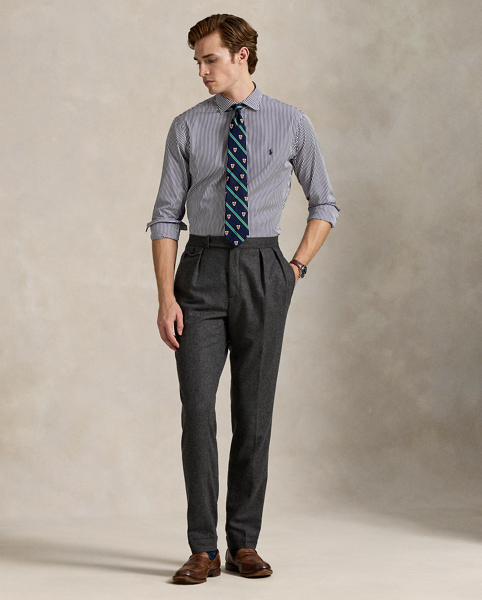 Meticulously crafted with lightweight cotton poplin, this striped shirt delivers impeccable Polo style with its crisp texture and precise tailoring. The classic design is further elevated by our iconic embroidered Pony, which adds a distinctive signature touch.