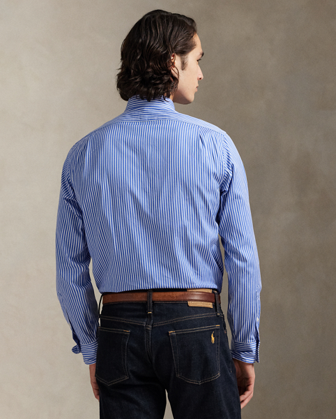 Meticulously crafted with lightweight cotton poplin, this striped shirt delivers impeccable Polo style with its crisp texture and precise tailoring. The classic design is further elevated by our iconic embroidered Pony, which adds a distinctive signature touch.