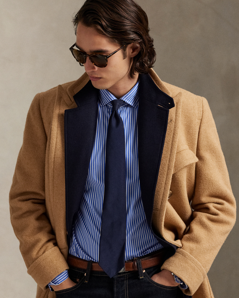 Meticulously crafted with lightweight cotton poplin, this striped shirt delivers impeccable Polo style with its crisp texture and precise tailoring. The classic design is further elevated by our iconic embroidered Pony, which adds a distinctive signature touch.