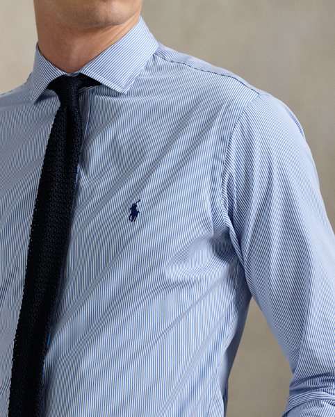 Meticulously crafted with lightweight cotton poplin, this striped shirt delivers impeccable Polo style with its crisp texture and precise tailoring. The classic design is further elevated by our iconic embroidered Pony, which adds a distinctive signature touch.