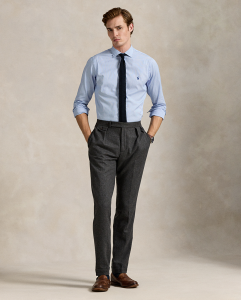 Meticulously crafted with lightweight cotton poplin, this striped shirt delivers impeccable Polo style with its crisp texture and precise tailoring. The classic design is further elevated by our iconic embroidered Pony, which adds a distinctive signature touch.