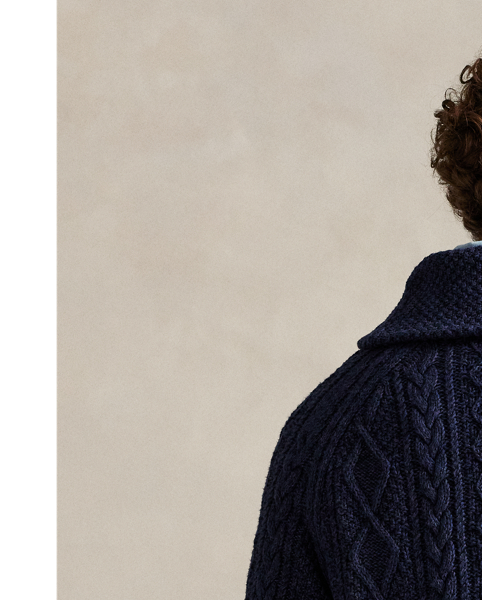 This cardigan is crafted from thick-gauge cotton yarn and features a textured Aran-knit construction.