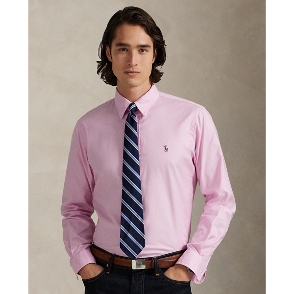 The Oxford shirt made its debut very early in  Ralph Lauren Lauren’s designs, and since then, it has solidified its status as a pillar of the Polo look. Our fabric is developed with a secret wash, giving it instant character, ease and a heathered softness – what we refer to as "the perfect rumple". The formula is so unique that it's been kept in a safe for more than three decades. Today, Mr Lauren continues to create countless variations of his iconic shirt, including this version that is woven with a hint of stretch for added comfort.