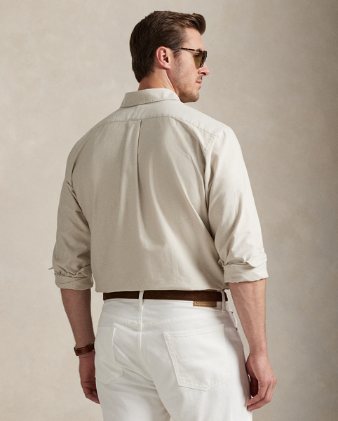 The oxford shirt made its debut very early in Ralph Lauren Lauren’s designs, and since then, it has solidified its status as a pillar of the Polo look. Our fabric is developed with a secret wash, which gives it instant character, ease and a heathered softness – what we refer to as "the perfect rumple". The formula is so unique that it's been kept in a safe for more than three decades. Today, Mr Lauren continues to create countless variations of his iconic shirt, including this Big & Tall version, which is embroidered with our multicoloured signature Pony.