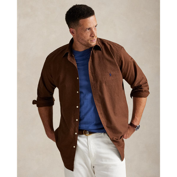 The oxford shirt made its debut very early in Ralph Lauren Lauren’s designs, and since then, it has solidified its status as a pillar of the Polo look. Our fabric is developed with a secret wash, giving it instant character, ease and a heathered softness – what we refer to as "the perfect rumple". The formula is so unique that it's been kept in a safe for more than three decades. Today, Mr Lauren continues to create countless variations of his iconic shirt, including this Big & Tall version, which is garment-dyed and treated for a broken-in look and feel from day one.