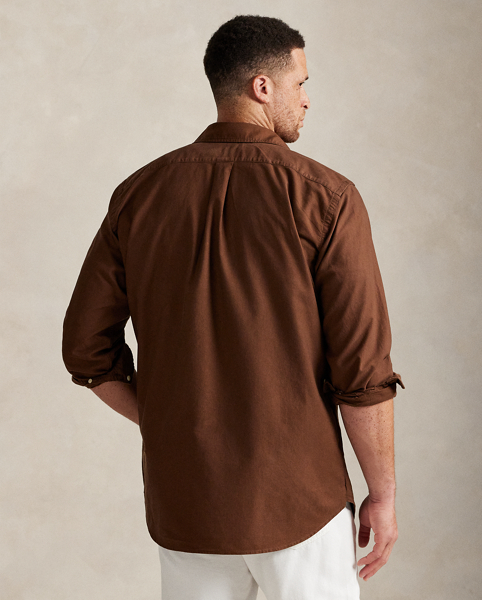 The oxford shirt made its debut very early in Ralph Lauren Lauren’s designs, and since then, it has solidified its status as a pillar of the Polo look. Our fabric is developed with a secret wash, giving it instant character, ease and a heathered softness – what we refer to as "the perfect rumple". The formula is so unique that it's been kept in a safe for more than three decades. Today, Mr Lauren continues to create countless variations of his iconic shirt, including this Big & Tall version, which is garment-dyed and treated for a broken-in look and feel from day one.