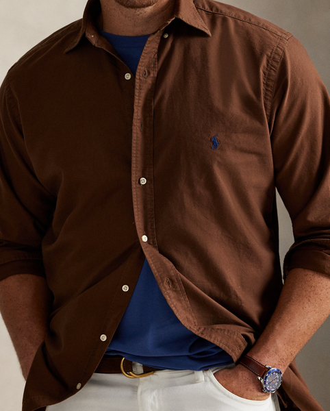 The oxford shirt made its debut very early in Ralph Lauren Lauren’s designs, and since then, it has solidified its status as a pillar of the Polo look. Our fabric is developed with a secret wash, giving it instant character, ease and a heathered softness – what we refer to as "the perfect rumple". The formula is so unique that it's been kept in a safe for more than three decades. Today, Mr Lauren continues to create countless variations of his iconic shirt, including this Big & Tall version, which is garment-dyed and treated for a broken-in look and feel from day one.