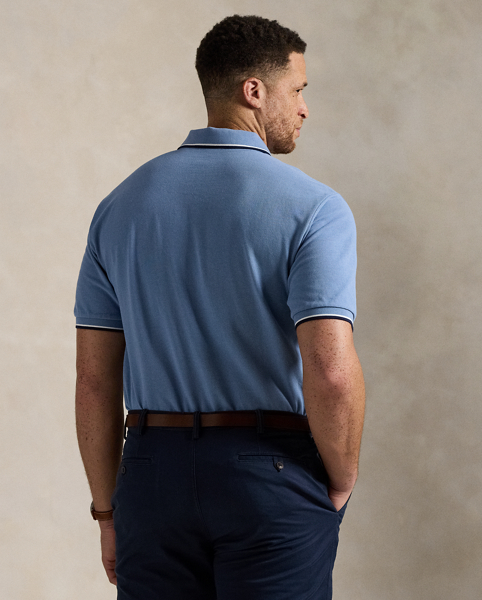 An American style standard since 1972, the Polo shirt has been imitated but never matched. Over the decades, Ralph Lauren Lauren has reimagined his signature style in a wide array of colours and fits, yet all retain the quality and attention to detail of the iconic original. This Big & Tall version is made from our highly breathable cotton mesh, which offers a textured look and a soft feel.