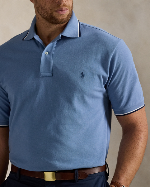 An American style standard since 1972, the Polo shirt has been imitated but never matched. Over the decades, Ralph Lauren Lauren has reimagined his signature style in a wide array of colours and fits, yet all retain the quality and attention to detail of the iconic original. This Big & Tall version is made from our highly breathable cotton mesh, which offers a textured look and a soft feel.
