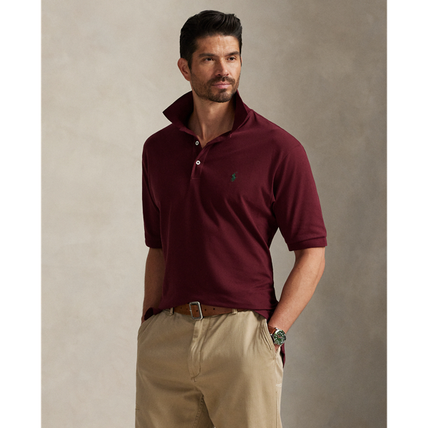 An American style standard since 1972, the Polo shirt has been imitated but never matched. Over the decades, Ralph Lauren Lauren has re-imagined his signature style in a wide array of colours and fits, yet all retain the quality and attention to detail of the iconic original. This Big & Tall version includes a hint of stretch, allowing for unparalleled ease of movement and comfort. It is finished with genuine mother-of-pearl buttons on the placket.