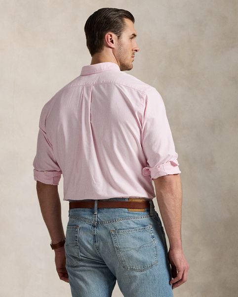 The oxford shirt made its debut very early in Ralph Lauren Lauren’s designs, and since then, it has solidified its status as a pillar of the Polo look. Our fabric is developed with a secret wash, which gives it instant character, ease and a heathered softness. The formula is so unique that it's been kept in a safe for more than three decades. In addition to details evoking its prep-school inspiration, it offers a relaxed feel, producing what we refer to as "the perfect rumple". Today, Mr Lauren continues to create countless variations of his iconic shirt, including this Big & Tall version, which is embroidered with our multicoloured signature Pony.