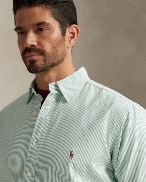 The oxford shirt made its debut very early in Ralph Lauren Lauren’s designs, and since then, it has solidified its status as a pillar of the Polo look. Our fabric is developed with a secret wash, which gives it instant character, ease and a heathered softness. The formula is so unique that it's been kept in a safe for more than three decades. In addition to details evoking its prep-school inspiration, it offers a relaxed feel, producing what we refer to as "the perfect rumple". Today, Mr Lauren continues to create countless variations of his iconic shirt, including this Big & Tall version, which is embroidered with our multicoloured signature Pony.