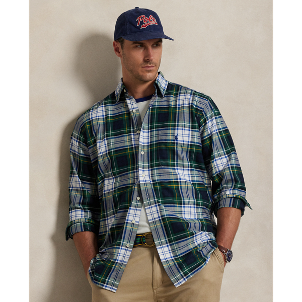 The oxford shirt made its debut very early in  Ralph Lauren Lauren’s designs, and since then, it has solidified its status as a pillar of the Polo look. Our fabric is developed with a secret wash, giving it instant character, ease and a heathered softness – what we refer to as "the perfect rumple". The formula is so unique that it's been kept in a safe for more than three decades. Today, Mr Lauren continues to create countless variations of his iconic shirt, including this plaid Big & Tall version, which is embroidered with our multicoloured signature Pony.
