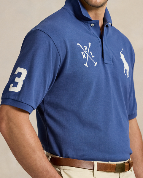 An American style standard since 1972, the Polo shirt has been imitated but never matched. Over the decades, Ralph Lauren Lauren has re-imagined his signature style in a wide array of colours and fits, yet all retain the quality and attention to detail of the iconic original. This Big & Tall version is made with our highly breathable cotton mesh and features a twill "3" patch, which is the number typically worn by a polo team's strongest player.