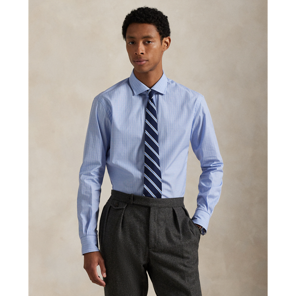 Expertly tailored using 140s-quality, two-ply cotton poplin, this plaid shirt exemplifies Ralph Lauren Lauren's dedication to superior craftsmanship. The luxuriously lightweight garment is finished with genuine mother-of-pearl buttons, creating a sophisticated piece that's purely Polo.