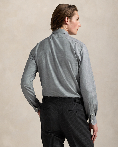 This shirt is crafted from 120s-quality, two-ply cotton twill offering a silky smooth finish. It features custom-developed genuine mother-of-pearl buttons and a tonal plaid pattern.