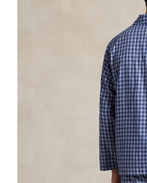 Crafted with lightweight woven cotton, the long-sleeve shirt and trousers in this pyjama set are printed all over with a monogram motif.