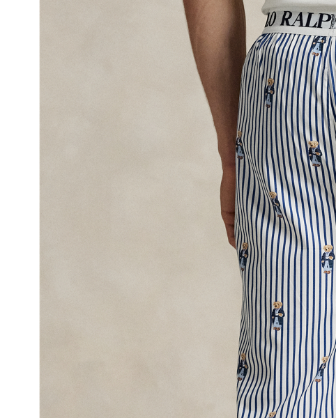 Crafted with crisp cotton poplin, these lightweight pyjama trousers feature an allover pattern of the iconic Polo Bear on a striped background.
