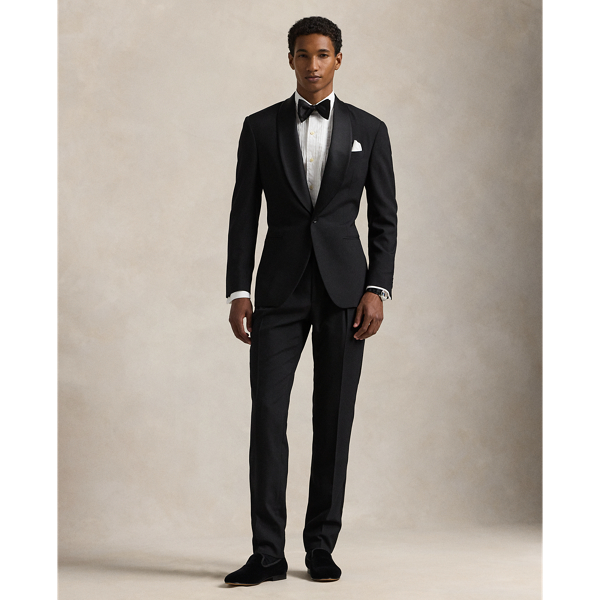 Our Polo tuxedo jacket offers more structure in the chest and shoulders along with full lining. This version, which is paired with double-pleated trousers, is tailored in Italy from custom-developed wool barathea cloth and finished with silk-blend trim.