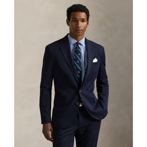 Our Polo suit jacket offers more structure in the chest and shoulders along with full lining. This version is crafted with a twill cloth that is custom-developed for natural wrinkle resistance and a smooth, shine-free finish. Added stretch provides extra comfort, making this lightweight layer perfect for all-season, everyday wear.