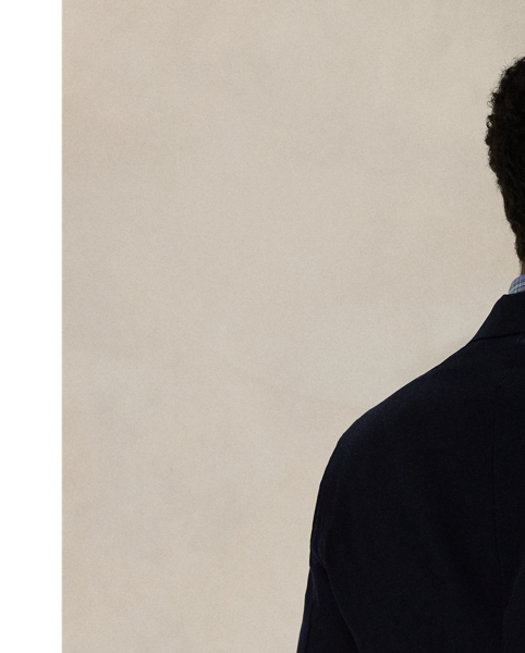 Our Polo suit jacket offers more structure in the chest and shoulders along with full lining. This version is crafted with a twill cloth that is custom-developed for natural wrinkle resistance and a smooth, shine-free finish. Added stretch provides extra comfort, making this lightweight layer perfect for all-season, everyday wear.