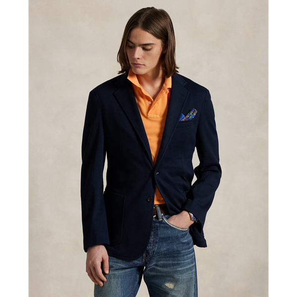 Our Polo Soft sport coat puts a modern spin on classic preppy style with a natural shoulder, slightly structured chest and partial lining. Made from a custom-developed mesh fabric, it combines the comfort of sportswear with the sophisticated look of Polo tailoring.