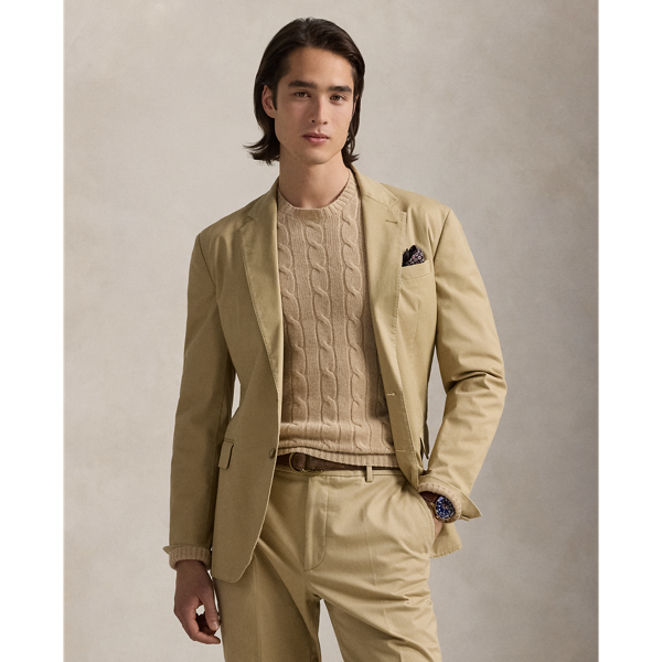 The Polo Unconstructed fit puts a modern spin on classic preppy style with a natural shoulder and light weight. This suit jacket is crafted with custom-developed chino fabric that was woven with extra stretch for added comfort. A special wash combined with a peached process imparts extraordinary softness along with a lightly broken-in appearance.