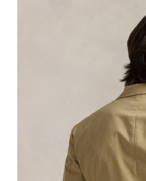 The Polo Unconstructed fit puts a modern spin on classic preppy style with a natural shoulder and light weight. This suit jacket is crafted with custom-developed chino fabric that was woven with extra stretch for added comfort. A special wash combined with a peached process imparts extraordinary softness along with a lightly broken-in appearance.