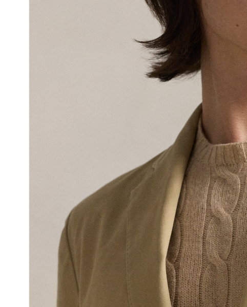 The Polo Unconstructed fit puts a modern spin on classic preppy style with a natural shoulder and light weight. This suit jacket is crafted with custom-developed chino fabric that was woven with extra stretch for added comfort. A special wash combined with a peached process imparts extraordinary softness along with a lightly broken-in appearance.