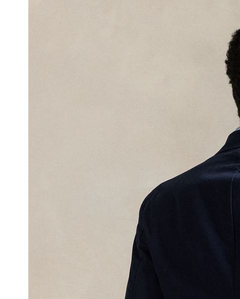 The Polo Unconstructed fit puts a modern spin on classic preppy style with a natural shoulder and light weight. This suit jacket is crafted with custom-developed chino fabric that was woven with extra stretch for added comfort. A special wash combined with a peached process imparts extraordinary softness along with a lightly broken-in appearance.