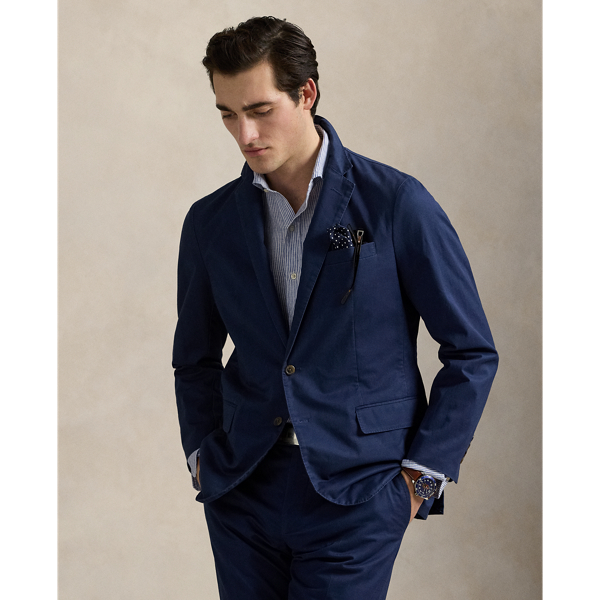 The Polo Unconstructed fit puts a modern spin on classic preppy style with a natural shoulder and light weight. This suit jacket is crafted with custom-developed chino fabric that was woven with extra stretch for added comfort. A special wash combined with a peached process imparts extraordinary softness along with a lightly broken-in appearance.