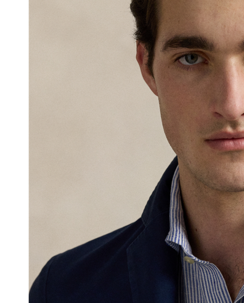 The Polo Unconstructed fit puts a modern spin on classic preppy style with a natural shoulder and light weight. This suit jacket is crafted with custom-developed chino fabric that was woven with extra stretch for added comfort. A special wash combined with a peached process imparts extraordinary softness along with a lightly broken-in appearance.