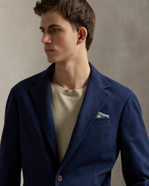 Our Polo Soft jacket puts a modern spin on classic preppy style with a natural shoulder, a slightly structured chest and a partial lining. This cotton-blend version is expertly tailored from a jersey piqué fabric that was custom-developed for Ralph Lauren Lauren.