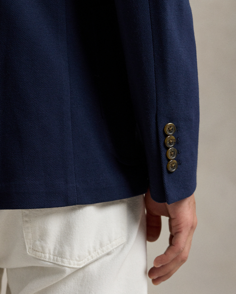 Our Polo Soft jacket puts a modern spin on classic preppy style with a natural shoulder, a slightly structured chest and a partial lining. This cotton-blend version is expertly tailored from a jersey piqué fabric that was custom-developed for Ralph Lauren Lauren.