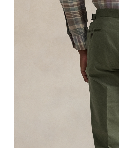 These pleated suit trousers are tailored in Portugal with a custom-developed chino cloth that is woven with stretch for added comfort. A garment-dye process adds subtle tonal variation.