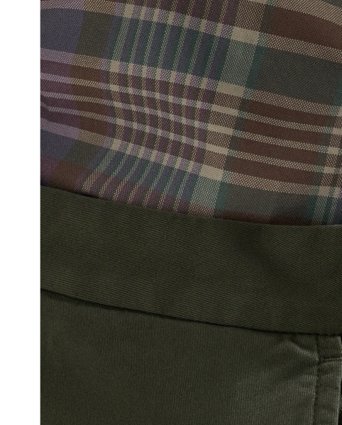 These pleated suit trousers are tailored in Portugal with a custom-developed chino cloth that is woven with stretch for added comfort. A garment-dye process adds subtle tonal variation.